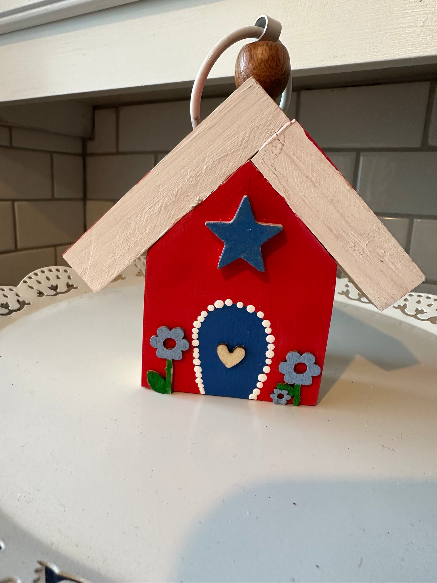 Tiny wood patriotic house.